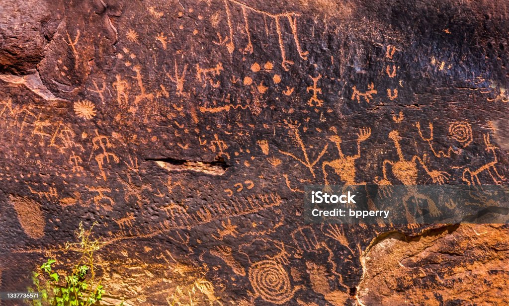 Indian Petroglyphs Newspaper Rock Petrified Forest National Park Arizona Indian Petroglyphs Newspaper Rock Petrified Forest National Park Arizona. Ancient symbols created between 1499BC and 1000AD scratched out on rocks by Native Americans Petroglyph Stock Photo