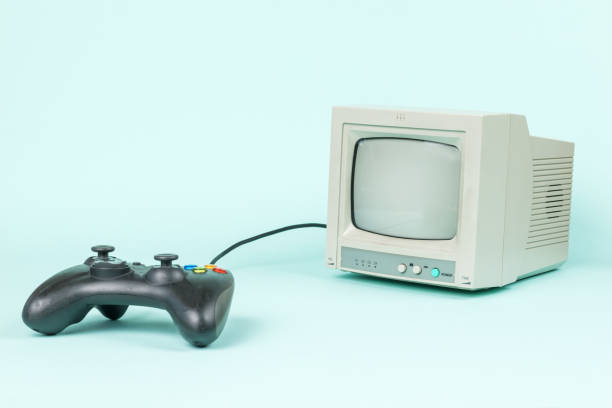 istock A black game console and a gray monitor on a light background. 1337737333