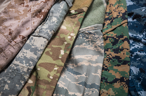 Different US Military uniform camouflage designs representing Marine corps, Army, Airforce and Navy.
