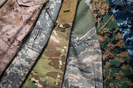 Different US Military uniform camouflage designs representing Marine corps, Army, Airforce and Navy.