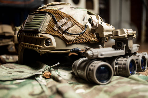 istock Tactical FAST helmet with US flag,  night vision goggles and multicam background 1337739535