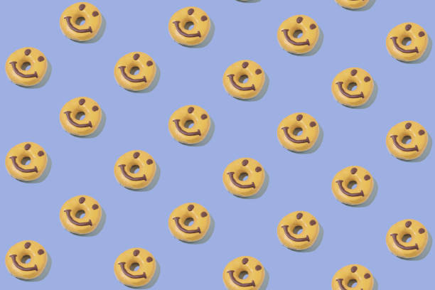 istock Isometric Pattern of a happy cheerful donut on a pastel blue background. Minimal dessert concept 1337746683