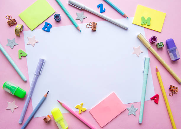 istock Frame of different stationery on pink background 1337746745