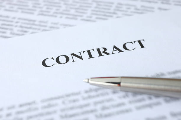 istock Metal ballpoint pen lying on documents with contract closeup 1337751285
