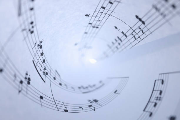 White paper with musical notes rolled up closeup background White paper with musical notes rolled up closeup background. Music writing concept composer photos stock pictures, royalty-free photos & images