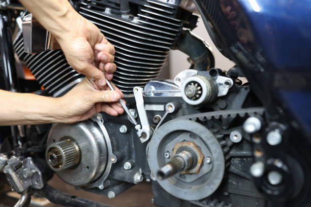 istock Master repairman repairing motorcycle in workshop closeup 1337751295