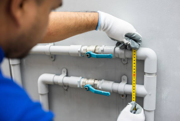 istock Male Plumber worker installation pipe system use tape measure level for calculate. Plumbing checking service and repair. 1337751392
