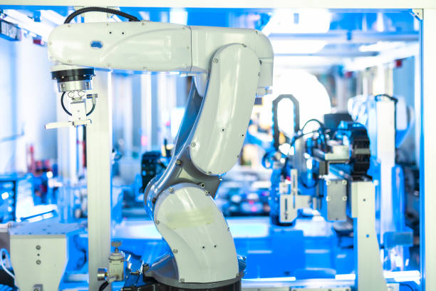istock Engineers Maintenance Robot Arm at Lab. he are in a High Tech Research Laboratory with Modern Equipment. Professional Japanese Development Engineer is Testing an Artificial Intelligence.start up 1337753460
