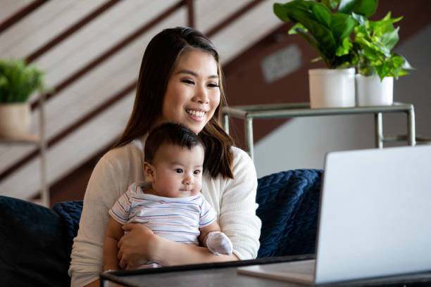 istock Mother working from home and caring for baby 1337754990
