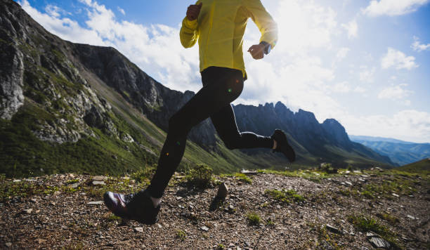 istock Woman runner running at mountain top 1337755595