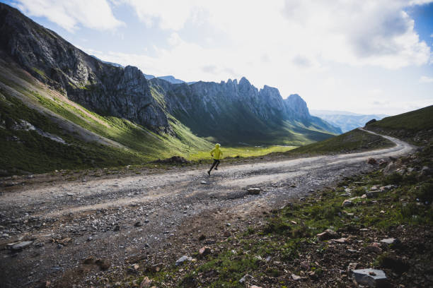 istock Woman runner running at mountain top 1337755600