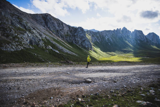 istock Woman runner running at mountain top 1337755609