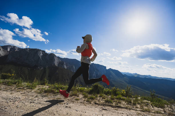 istock Young woman ultramarathon runner running at mountain top 1337755708