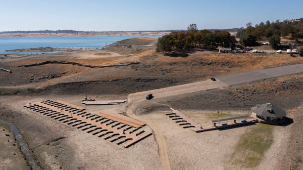 California Drought Aerial view of the severe drought conditions of Folsom Lake, a reservoir in Folsom, California, USA. lake bed stock pictures, royalty-free photos & images