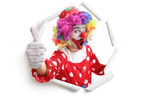 Mr Clown. Funny shocked face comedian Clown man in colorful costume wearing wig shout out loud wow with megaphone mouth announcement. Happy expression amazed bozo in various pose on isolated.