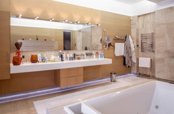 istock Functional bathroom with mirror with LED lighting and countertop for cosmetics 1337757778