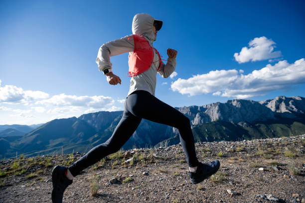 istock Young woman ultramarathon runner running at mountain top 1337760211