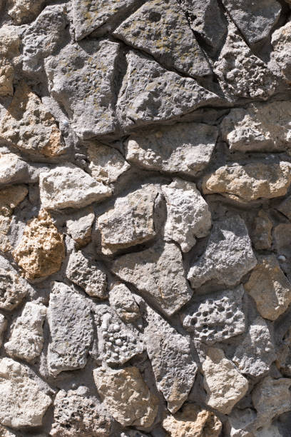 istock Old dirty wall close up. Grunge abstract photo background.  Beautiful stone texture pattern. 1337761373