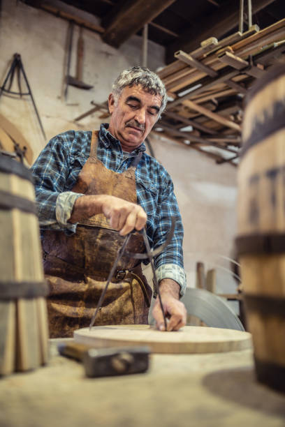 istock Hand tools used for measuring and assembling wooden products by an aged craftsman. 1337761724