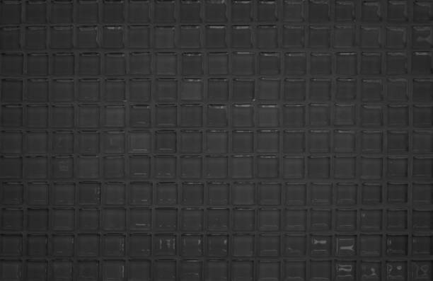 istock Black tile wall high resolution real photo or brick seamless  pattern and texture interior room background. Dark grid tiles wall texture for the decoration of the bedroom, Home or office backdrop. 1337761816