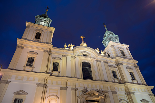 Holy Cross Church at night in Warsaw, Poland