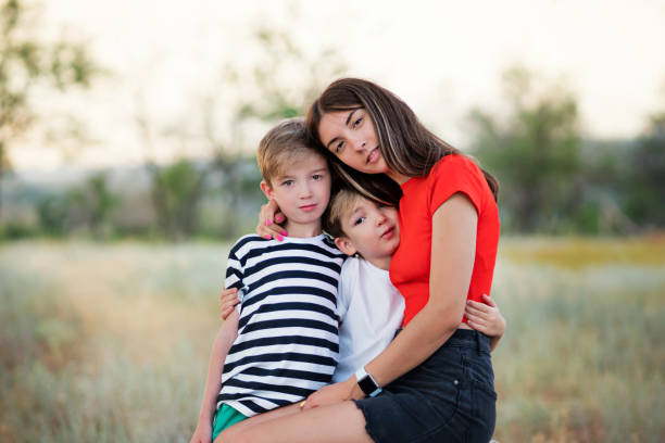 istock Loving mom with two sons outdoors 1337765735