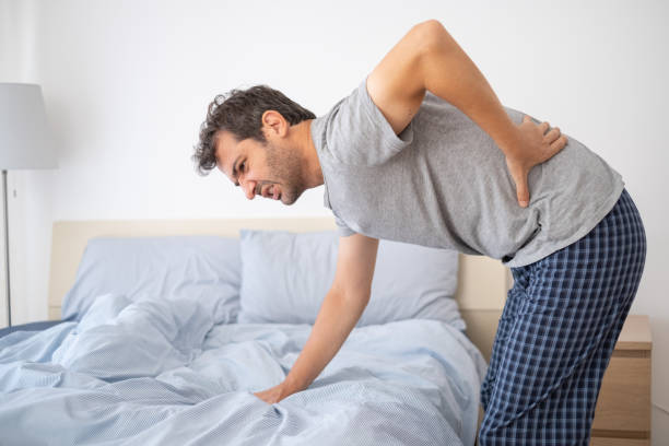 istock One man waking up and suffering from backache 1337767693