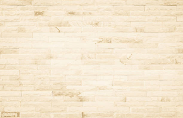 istock Empty background of wide cream brick wall texture. Beige old brown brick wall concrete or stone textured, wallpaper limestone abstract flooring/Grid uneven interior rock. Home decor design backdrop. 1337767710
