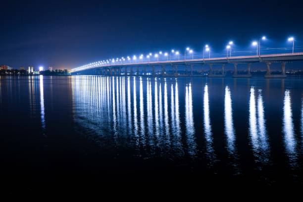 istock Reflection of bright lanterns in the Dnieper river under the bridge 1337768146