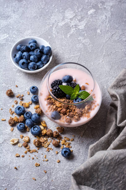 istock Yogurt dessert with blueberry, blackberry, granola and mint 1337768576