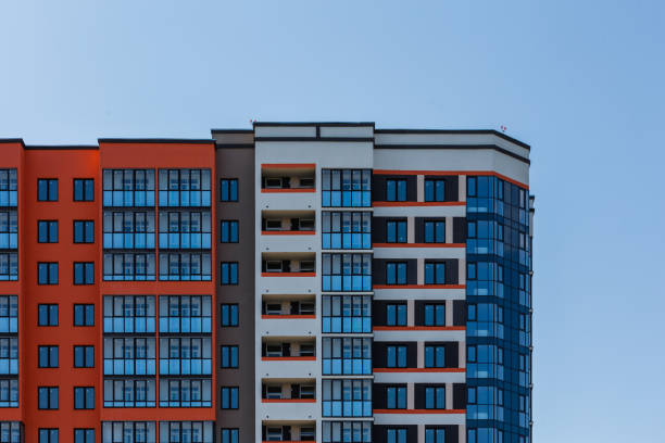istock new high rise apartament building with multiple balcony and windows on blue sky with white clouds background 1337769425