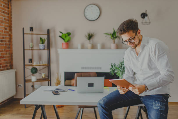 istock Young man working at home 1337771101