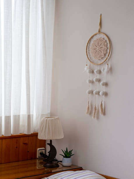 istock handmade dream catcher hanging on bedroom wall. 1337771900