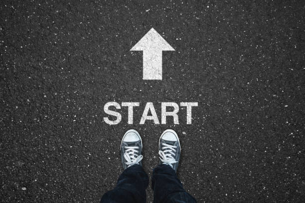 istock Begining Concepts - Start text and white arrow sign on asphalt road 1337772207