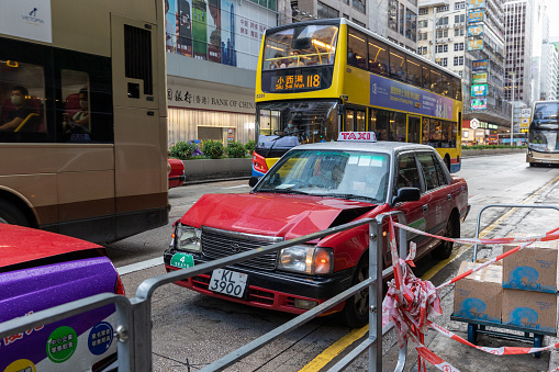 Hong Kong - September 1, 2021 : Taxi crash accident during a rainy day in Nathan Road, Mong Kok, Kowloon, Hong Kong.