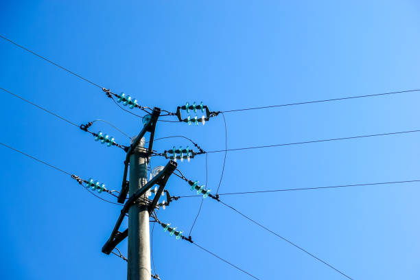 istock Electricity concept with power line against a blue sky 1337774502