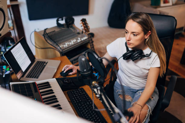 istock In the music studio, focused female sound engineer working on a post-production part 1337775596