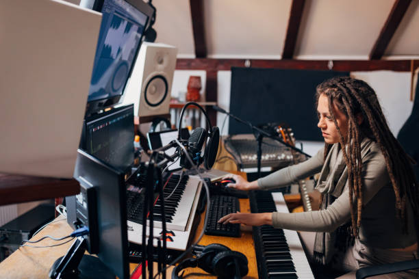 istock In modern digital audio workstation, female artist, engineering sounds she make with electric music keyboard 1337776218
