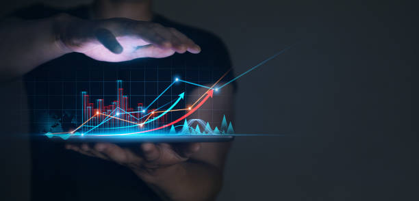 istock Businessman holding tablet with  growing virtual hologram of statistics, graph and chart.Business strategy development and growing growth plan 1337780793