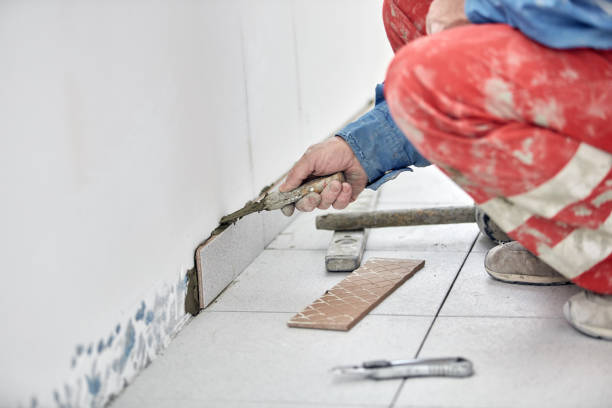 istock Ceramics tile man worker placing new tiles on the floor and wall. 1337781066