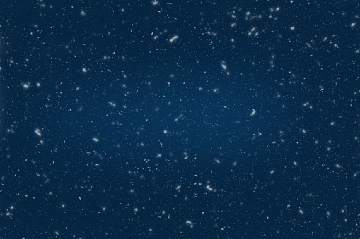 Fondo azul oscuro nocturno para el invierno con copos de nieve. photo