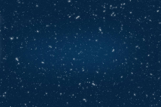 Blue dark night background for winter with snowflakes.
