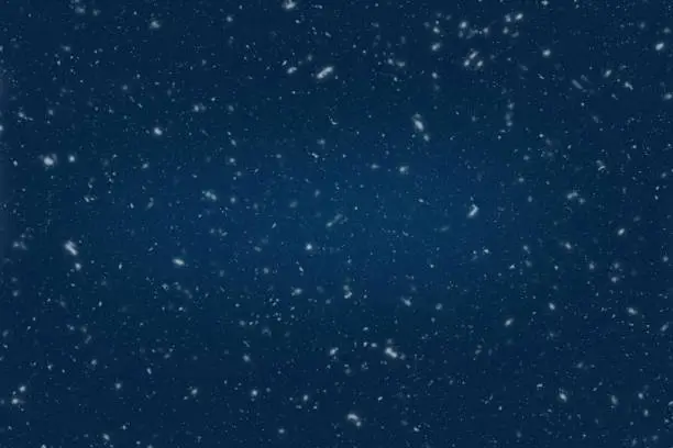 Photo of Blue dark night background for winter with snowflakes.