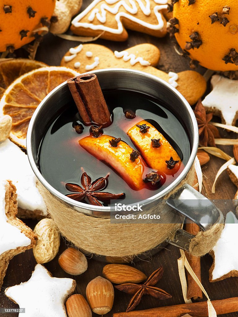 Mulled wine Mulled wine with spices and christmas cookies. Shallow dof. Adult Stock Photo