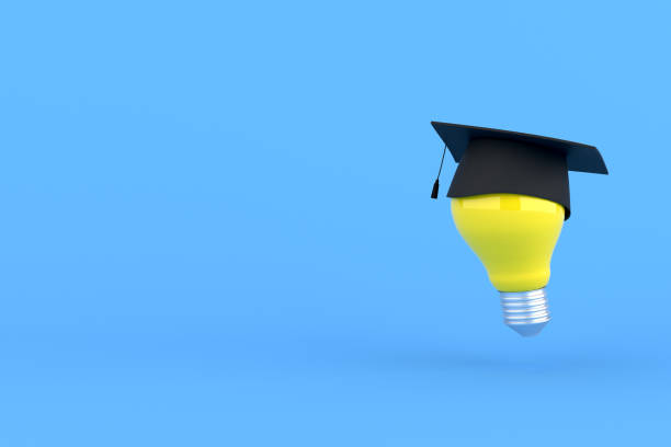 istock 3d rendering of graduation cap on yellow light bulb. 1337784482