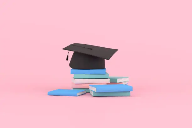 Photo of 3d rendering of graduation cap and books on pink background.