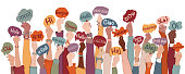 istock Many arms raised of diverse and multi-ethnic people holding speech bubbles with text -hallo- in various international languages. Diversity people.Racial equality.Sharing and collaboration 1337786250