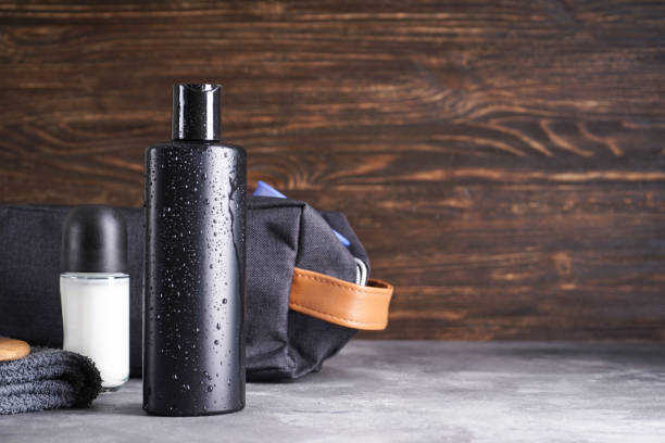 istock Bottle of shampoo and deodorant on a wooden background, space for text. 1337792185