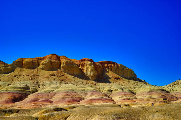 istock Wind eroded square hills, minarets, peaks, Efege mounds. Clean blue sky. 1337792430