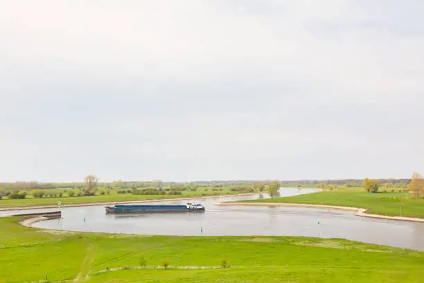 Photo of Cargo inland ship on the river IJssel near Zutphen in Gelderland